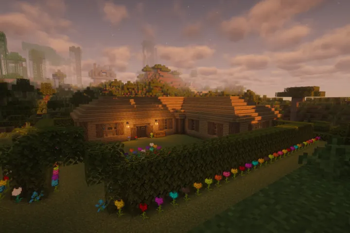 A flower-lined cottage settles into golden hour.